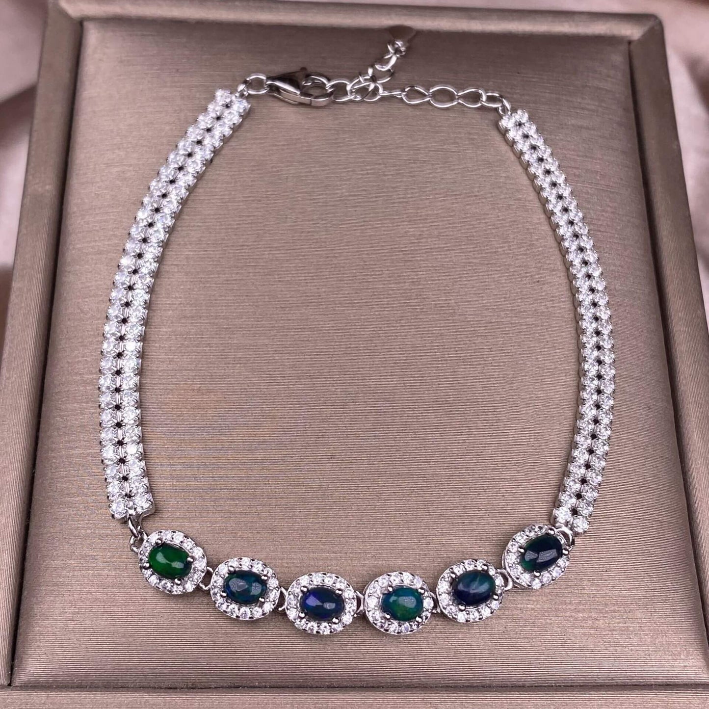 Black Opal Diopside, olivine Bracelet The S925 silver bracelet, inlaid with numerous diamonds, is an exquisite and light luxury Australian jewelry piece. It is dazzling and free of impurities, a fashionable OL silver accessory