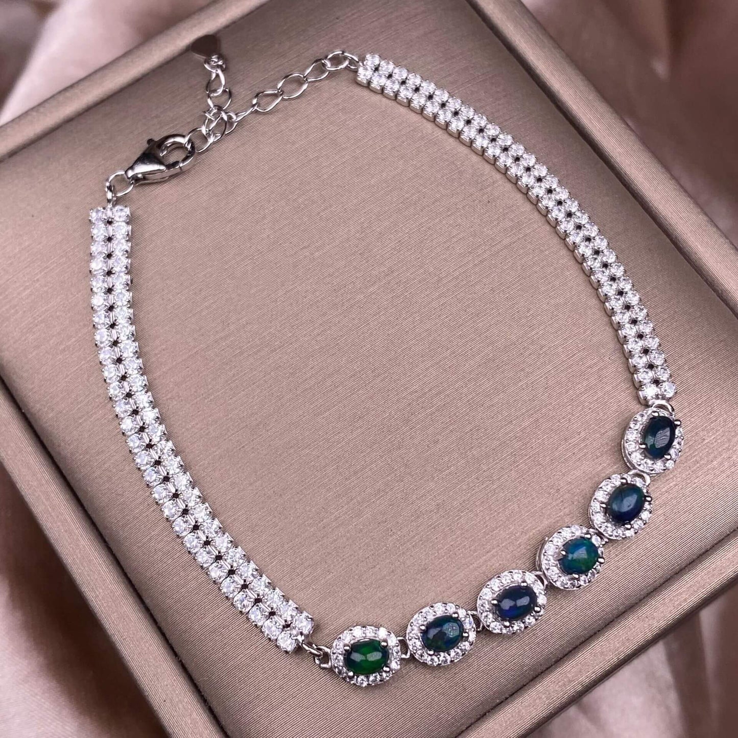 Black Opal Diopside, olivine Bracelet The S925 silver bracelet, inlaid with numerous diamonds, is an exquisite and light luxury Australian jewelry piece. It is dazzling and free of impurities, a fashionable OL silver accessory