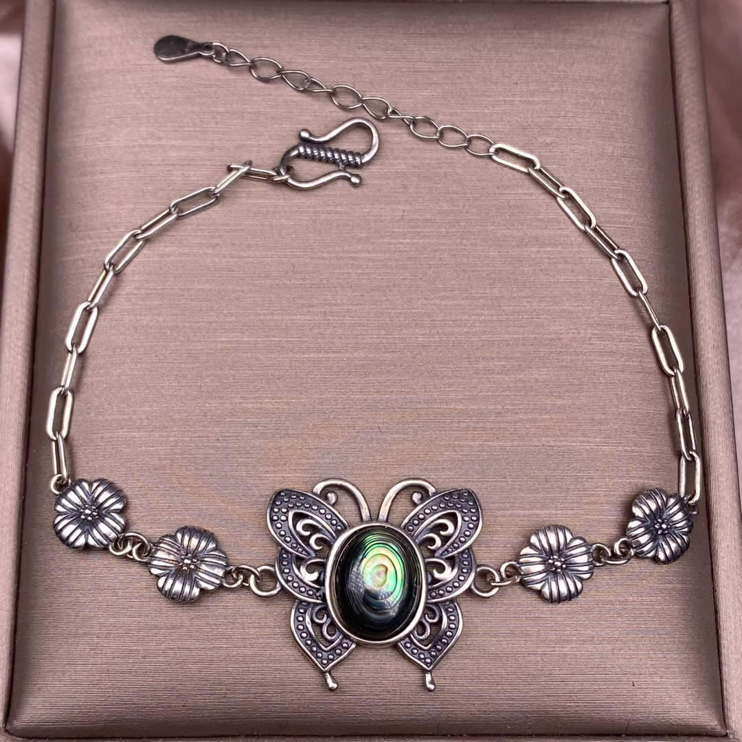 Turquoise, abalone shells, grey moonstone, copper hair crystal, rose quartz, grape stone, purple lithium oxide, opal, old wax, Larima Bracelet The s925 silver inlaid vintage silver butterfly-shaped shell jewelry has a strong lustrous effect