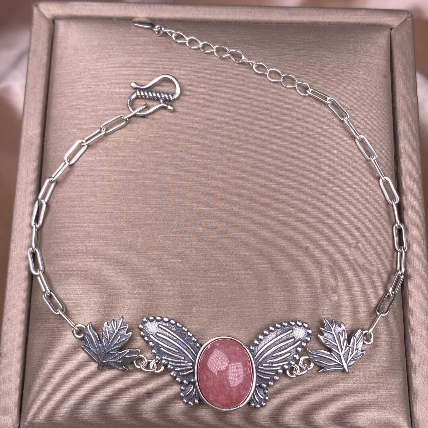 Silver bracelet with butterfly and leaf designs south red