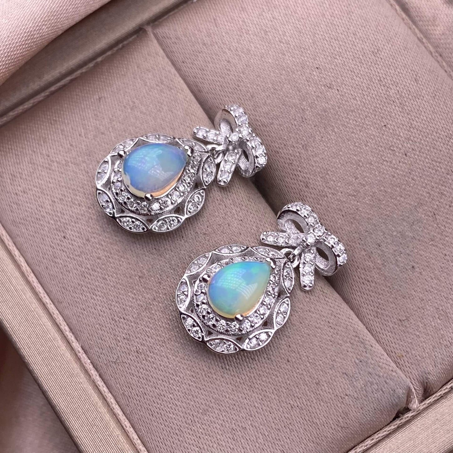 Pair of silver earrings with gemstones opal