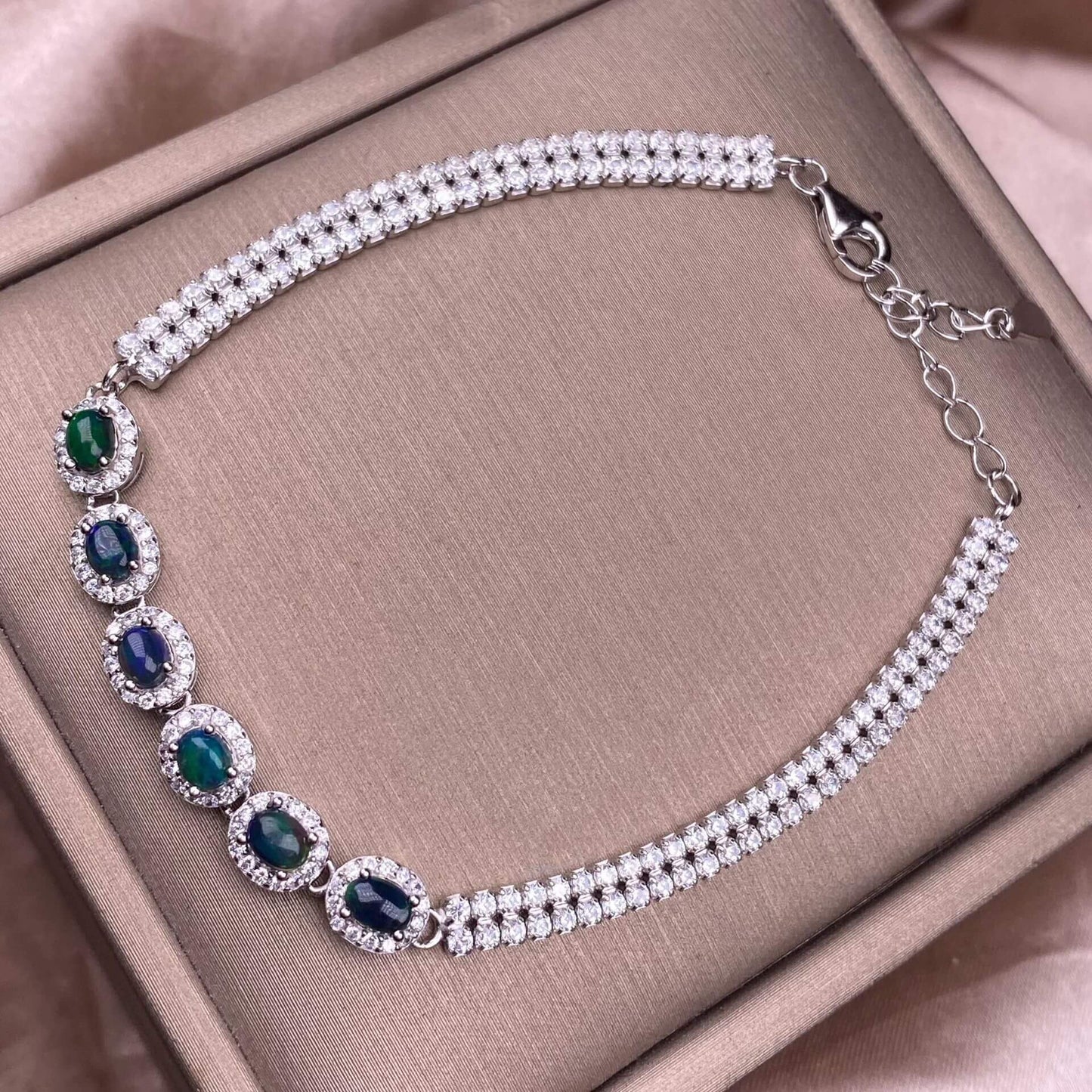 Black Opal Diopside, olivine Bracelet The S925 silver bracelet, inlaid with numerous diamonds, is an exquisite and light luxury Australian jewelry piece. It is dazzling and free of impurities, a fashionable OL silver accessory