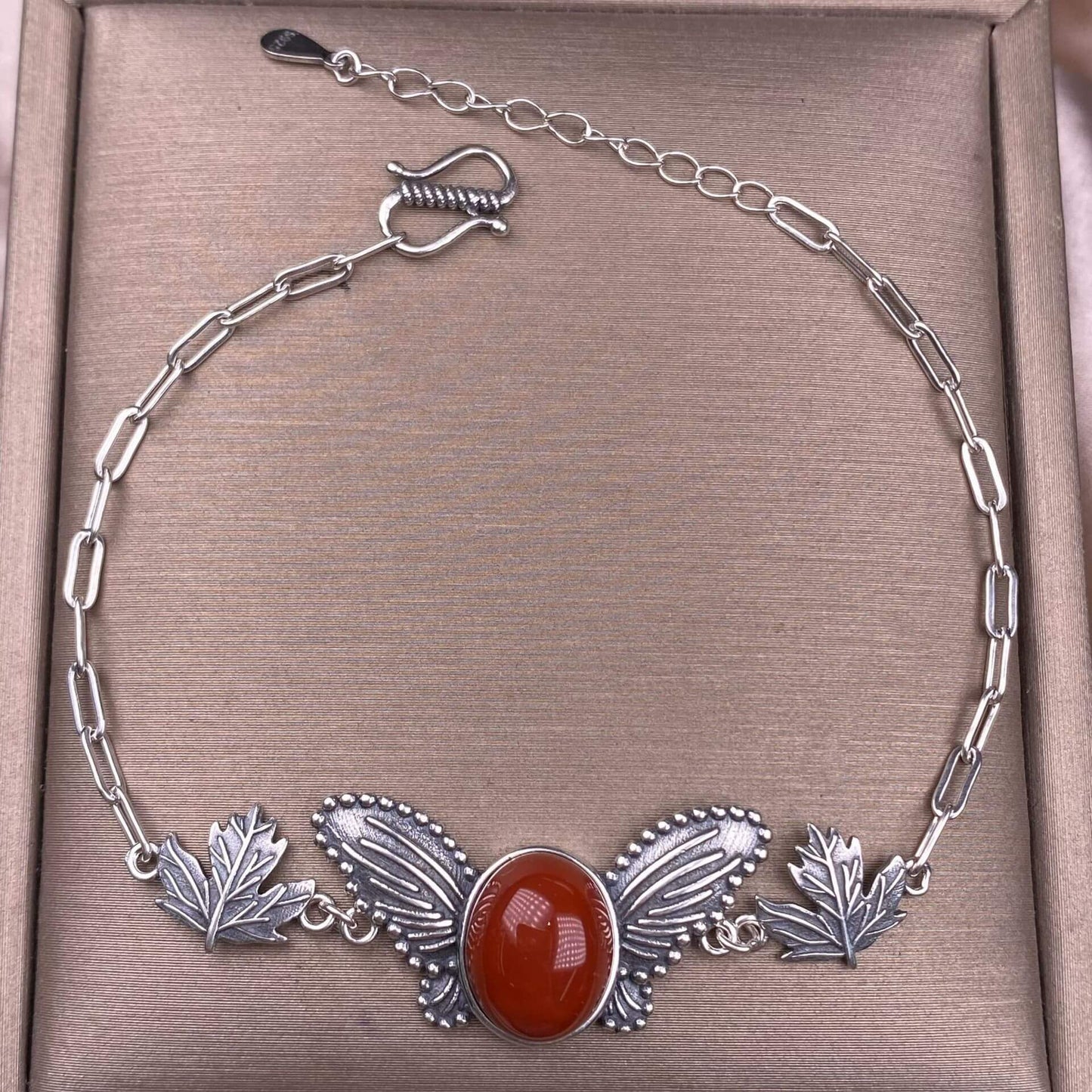 Silver bracelet with butterfly and leaf design Red jasper